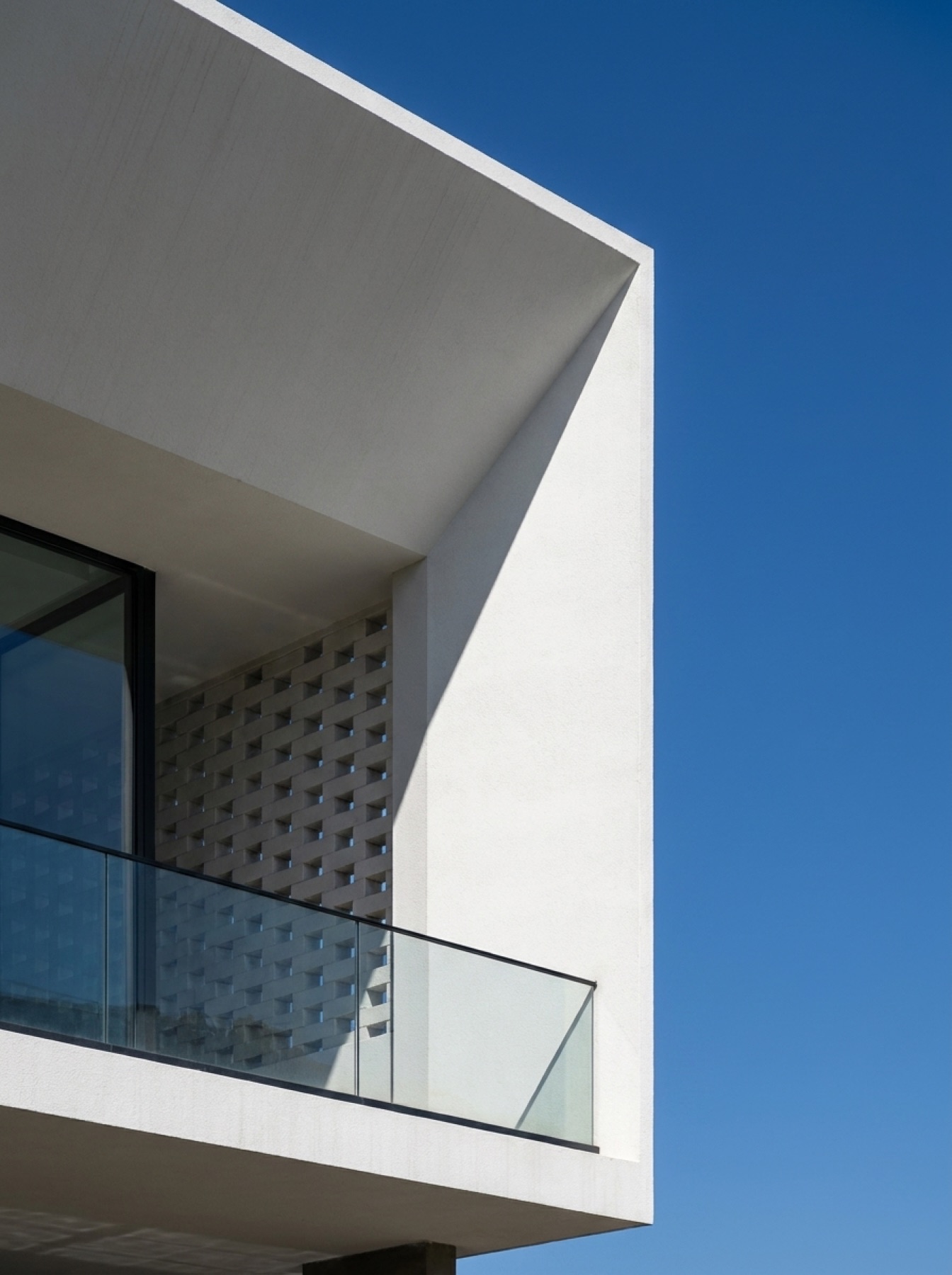 Sheltered balcony and perforated facade detail